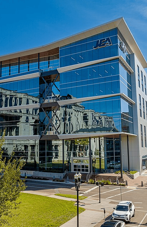 JEA office building with a glass facade and the JEA logo near the roofline